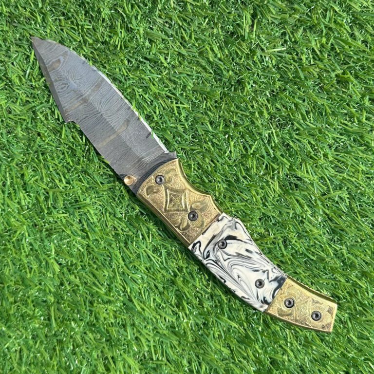 Premium Damascus pocket knife with hand-engraved brass and elegant marbled handle design