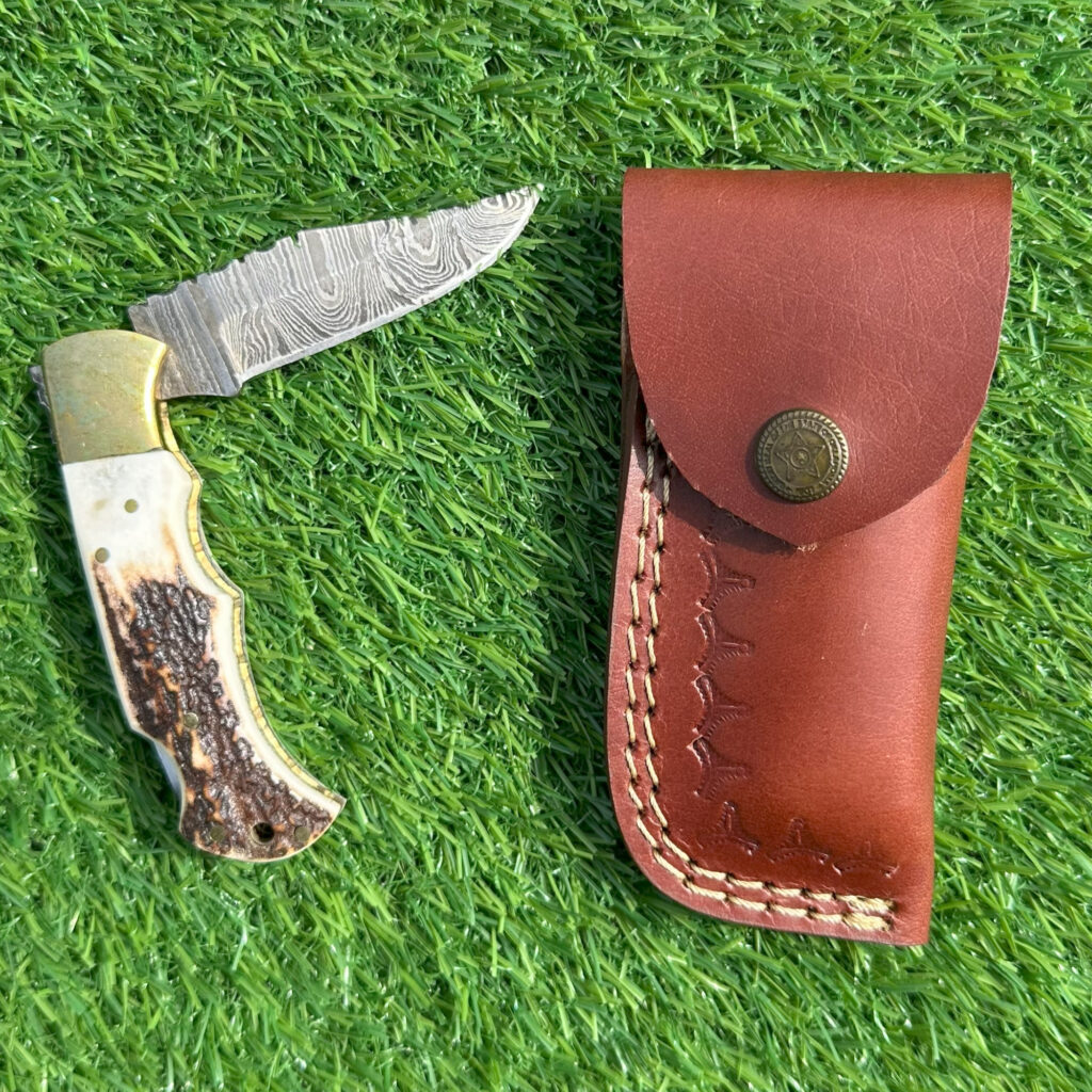 Complete Damascus hunting knife set with hand-stitched brown leather sheath