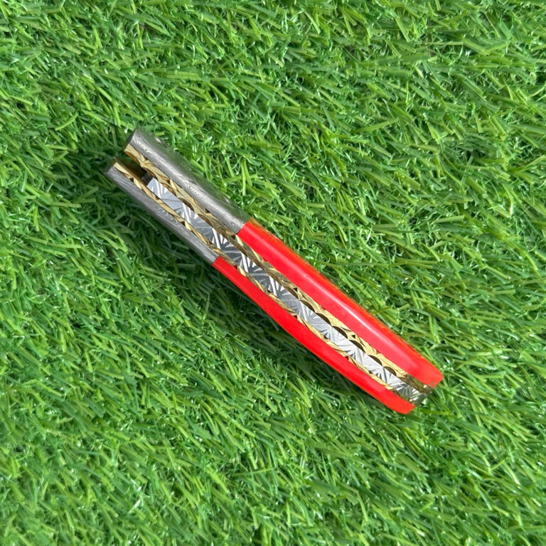 Damascus steel folding knife partially open showing liner lock mechanism