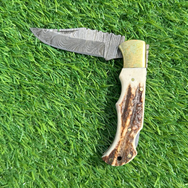 Hand forged Damascus steel hunting knife with camel bone handle and brass bolster