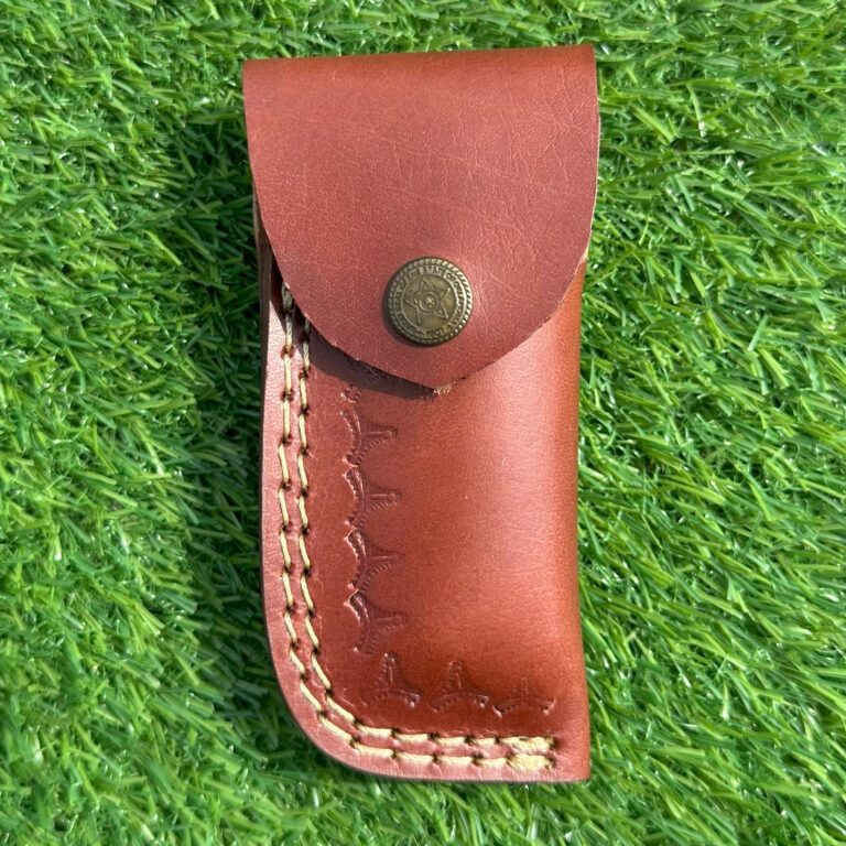 Premium leather sheath front view with brass button closure and hand stitching