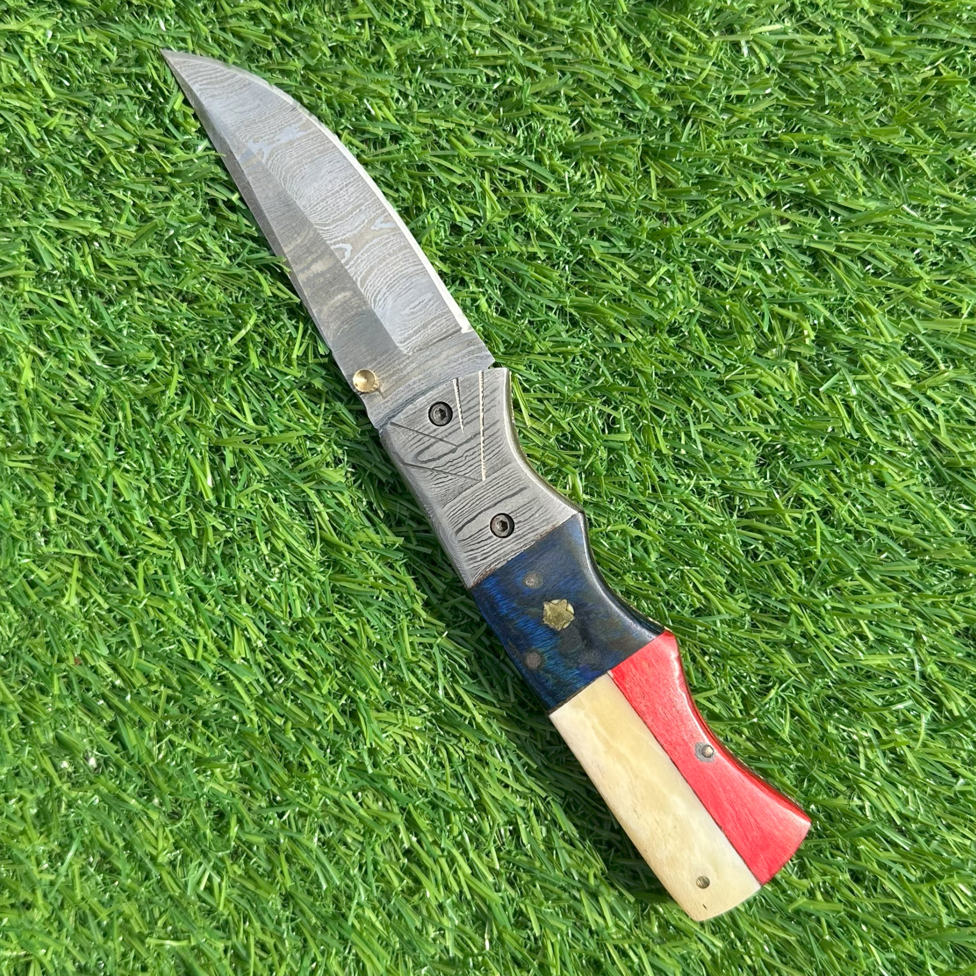Texas themed Damascus folding knife open view with patriotic handle and Damascus blade